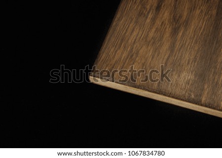 Wooden product made of wood on a black background