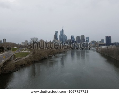 Philadelphia skyline reflecting off the river with road