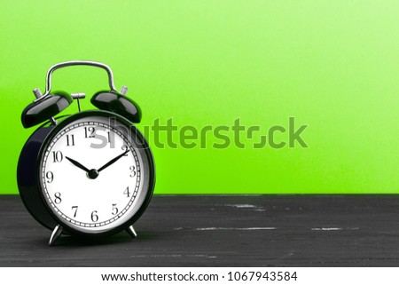 alarm clock on a wooden background