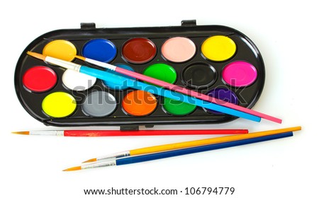 Watercolors with brushes isolated on white
