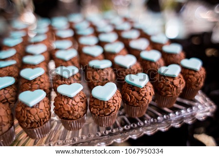 set of brigadeiro, brazilian chocolate candy with blue heart decoration, party dessert, candy