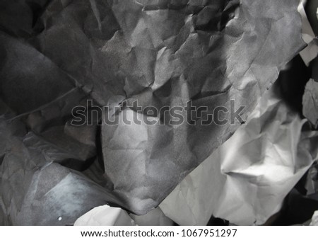 monochrome background of torn pieces of black and white paper