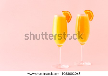 Yellow cocktail on a bright background, selective focus. Royalty-Free Stock Photo #1068003065