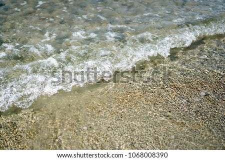 Sand and sea, concepts, leisure or travel.