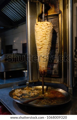 Picture of a Kebab cooking over heated flame