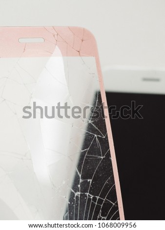 Broken glass screen rose smartphone in hand, white background.