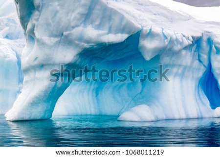 Archways on icebergs in Antarctica