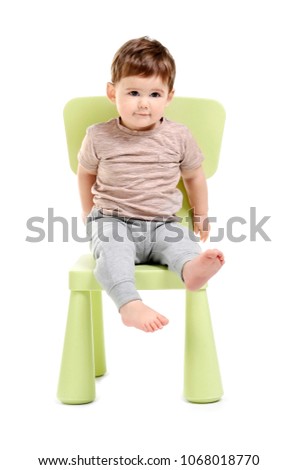 Cute baby sitting on chair against white background