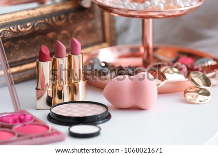 Decorative cosmetics on dressing table in makeup room Royalty-Free Stock Photo #1068021671