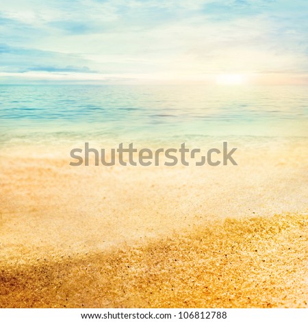 Beach summer background  with fine golden sand, sunset, sea and copyspace