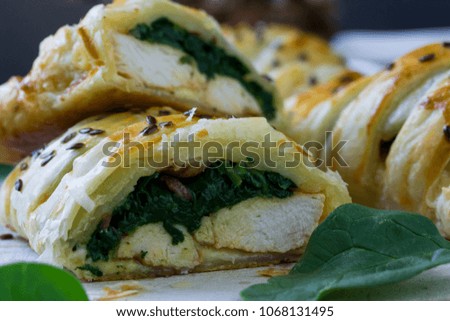 Chicken breast and spinach with garlic baked in puff pastry. 