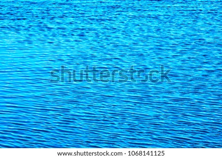  Abstract background of blue sea water. Surface of waves with blue tones as background.                              