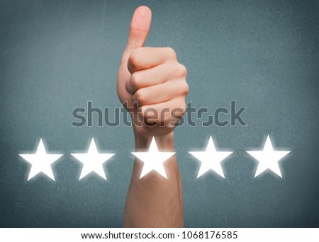 Businessman showing hand sign thumb up