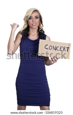 A beautiful woman with a sign hitch hiking to a concert