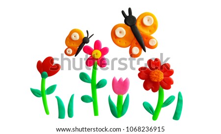 Plasticine colorful garden and orange butterfly isolated on a white background. Clipping path.
