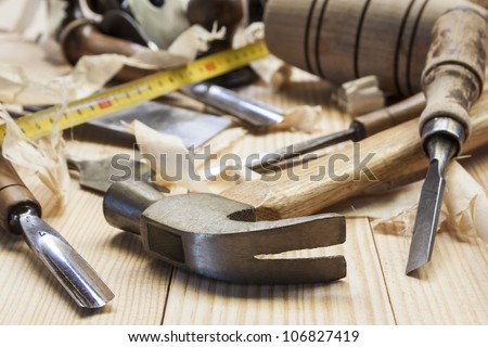carpenter tools in pine wood table Royalty-Free Stock Photo #106827419