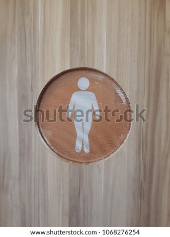 The man at the door of the toilet