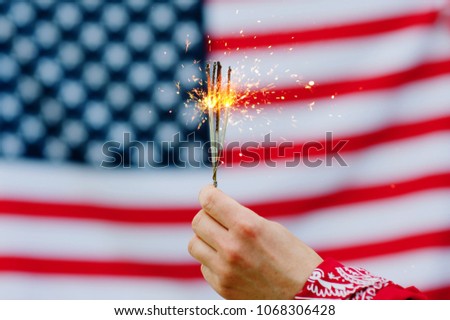 Bengal fire on the background of the flag of America
