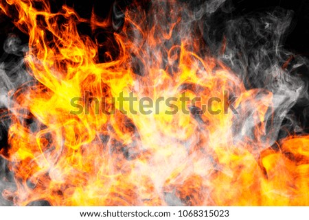 Fire flames background. Cloud of  fiery smoke on a black isolated background. Background from the smoke of vape