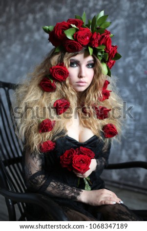 girl with red roses in her hair