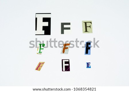 Set of collection colorful newspaper cut out letters as ornaments or design elements. Isolated on white background. Letter F. 