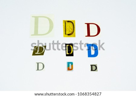 Set of collection colorful newspaper cut out letters as ornaments or design elements. Isolated on white background. Letter D. 