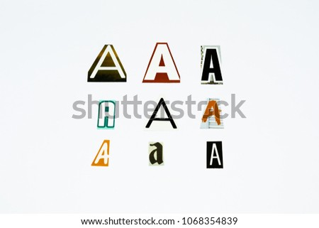 Set of collection colorful newspaper cut out letters as ornaments or design elements. Isolated on white background. Letter A. 