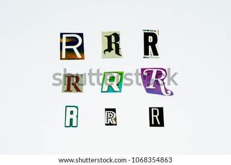 Set of collection colorful newspaper cut out letters as ornaments or design elements. Isolated on white background. Letter R.