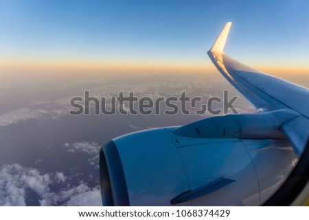 Morning sunrise with Wing of an airplane. Photo applied to tourism operators. picture for add text message or frame website. Traveling concept.