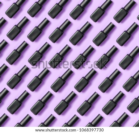 black nail polish on a pink purple background cover copying