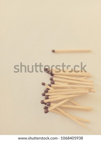 Bunch of fire matches on light white-beige background