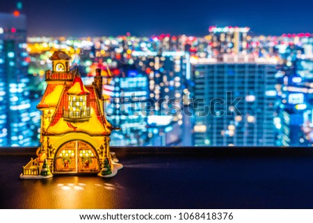 Asia business concept for real estate and corporate construction - panoramic blur city skyline aerial view under twilight sky with small light house in hamamatsucho, tokyo, Japan