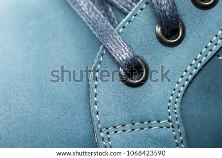 Leather (Nubuck) shoes, focus on details. Macro shot with shallow depth of field.