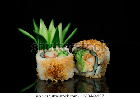 varieties of sushi on black background