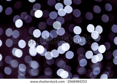 White large, almond-shaped bokeh of natural origin on a dark background.