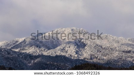 Mountain peak of Takayama,Gifu,Japan winter.Panorama of Snow Mountain Range Landscape with Blue Sky.