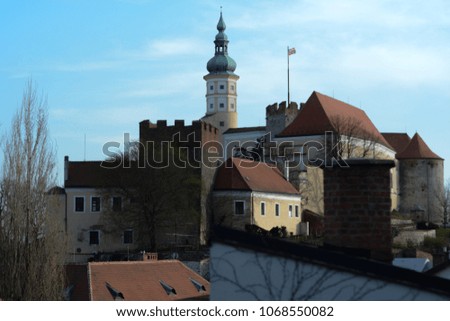 castle , clock tower Mikulov in the south Moravia, Czech republic, spring beautiful romantic touristic destination in the middle Europe , Dietrichstein castle with beautiful blue sky with clouds