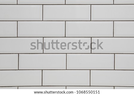 White subway tile wall and dark grout for a kitchen or bathroom backsplash Royalty-Free Stock Photo #1068550151