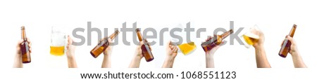 Bunch Of Hands Holding Mugs And Bottles Of Beer Up At Party Giving A Cheers Isolated On White Background