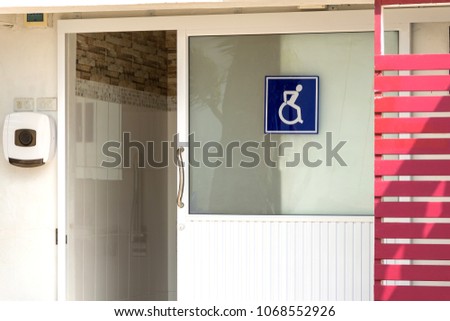 Accessible bathroom.Public restroom signs with a disabled access symbol