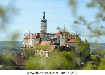 Mikulov castle / clock tower at the sunrise with nice blue smooth sky , Mikulov south Moravia , Czech republic , summer autumn spring touristic destination