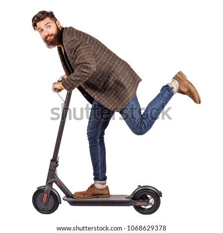 bearded man holding the electric scooter and riding it while feeling delighted. image on white background