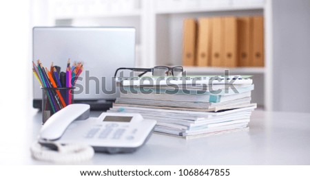 Workplace with notebook laptop Comfortable work table in office windows and city view