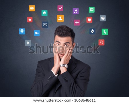 Young businessman with colorful applications over his head 