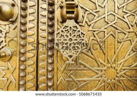 Close view of golden door with  knocker. Morocco