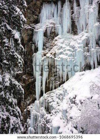 winter ice and snow wonderland in wild nature in the Alps