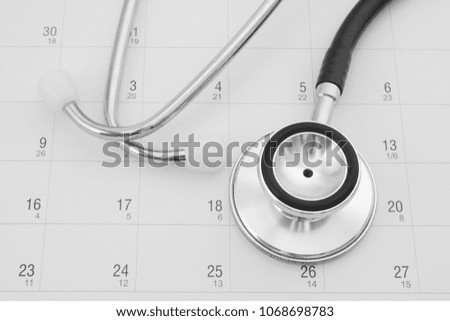 Calendar page and black stethoscope, regular medical examination