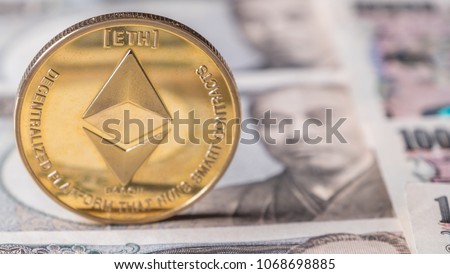Ethereum coin crypto currency on Japanese yen bank notes