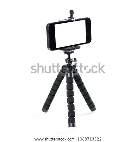 The phone on the tripod. Close up. Isolated on white background.