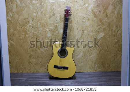 Guitar on wooden background recycled